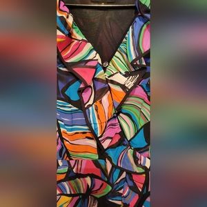 Beautiful Party Dress with ruffled cap sleeves and ruffled neckline.